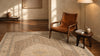 Antique rug in a warm interior with a leather chair